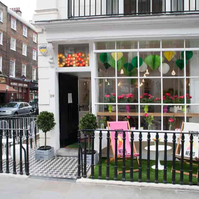 Charming restaurant venue with vibrant decor, ideal for casual events and meetings.