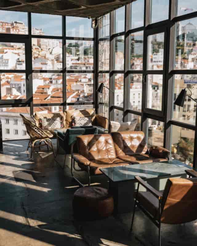 Stylish rooftop lounge in TOPO Lisboa with panoramic city views, ideal for networking events.