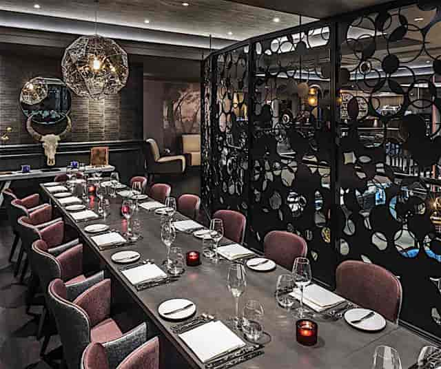 Private dining space with elegant table setting for intimate gatherings and corporate events.