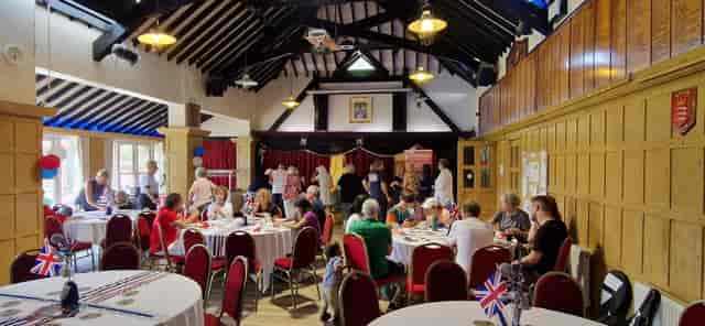 Lively Snooker Hall event with round tables and warm lighting in Bush Hill Park Club.