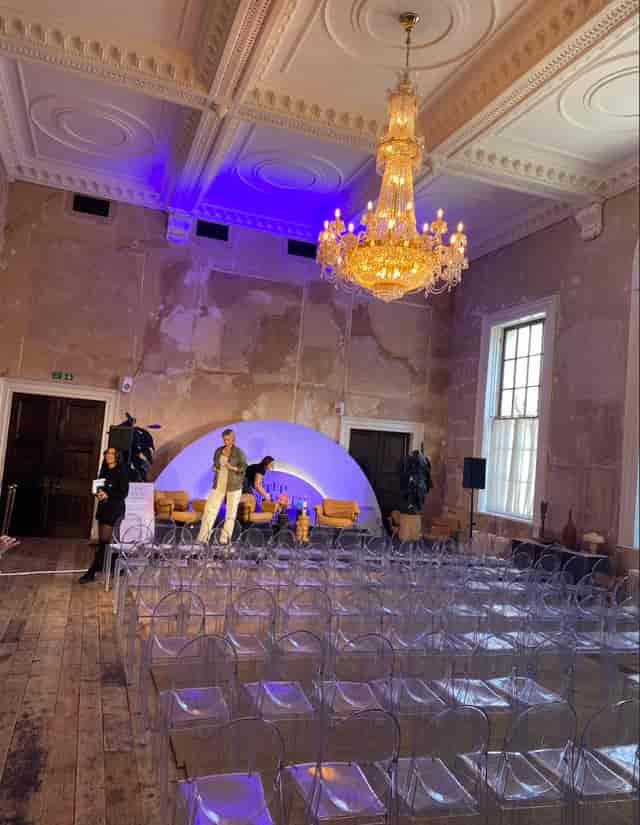 Stylish event space with modern seating for a panel discussion at Knotel Workclub.
