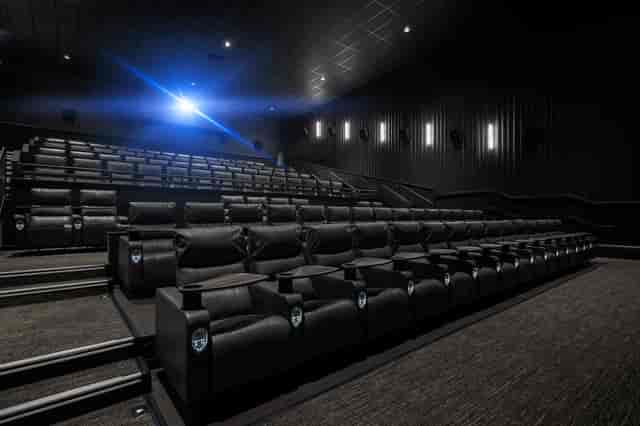 Upscale IMAX theater with plush seating for corporate events and private screenings.