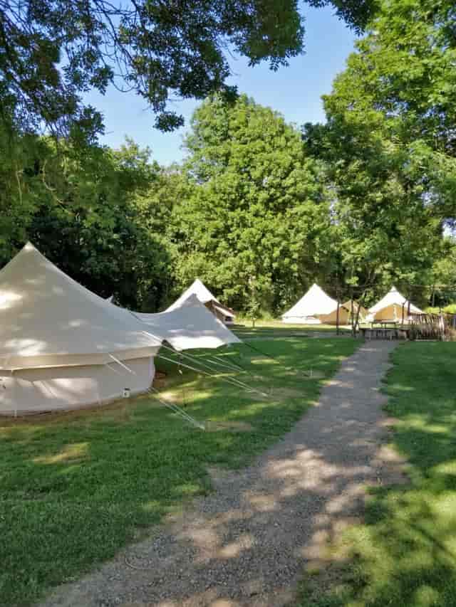 Bell Tents in a serene outdoor venue, perfect for weddings and corporate retreats.