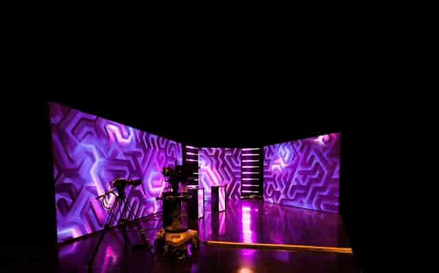 Podcast Room in Box7 with vibrant purple lighting for engaging live events.