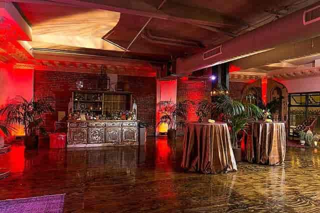 Elegant event space with warm lighting, ideal for social and corporate gatherings.