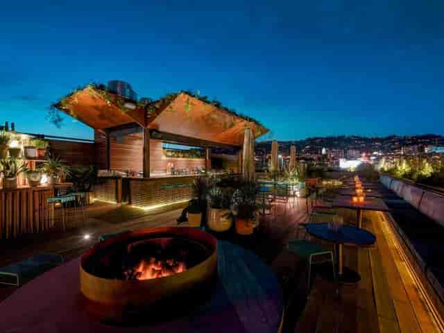 Rooftop restaurant venue with modern design, ideal for events and gatherings.