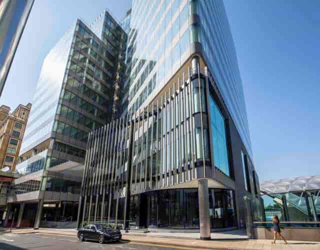 Modern glass building at Canary Wharf, ideal for corporate events and meetings.
