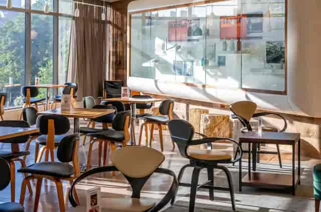Modern meeting space at Hotel 50 Bowery with natural light, ideal for gatherings and networking.