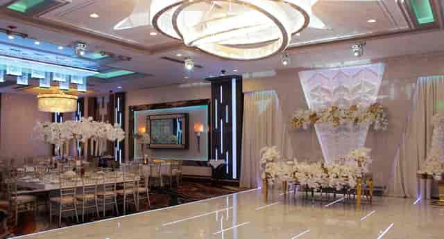 Elegant Manchester Banquet Hall ballroom with modern chandeliers for weddings and events.