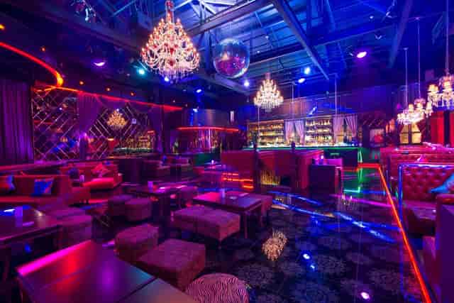 Vibrant event hall with stylish seating, perfect for networking and cocktail parties.