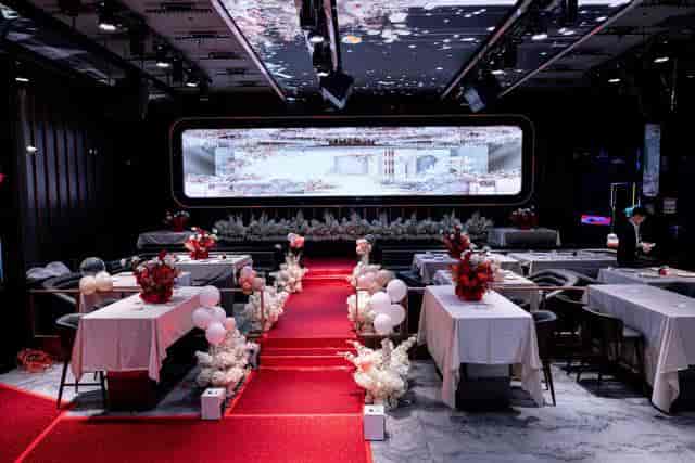 Elegant banquet hall with floral centerpieces, ideal for corporate events and celebrations.