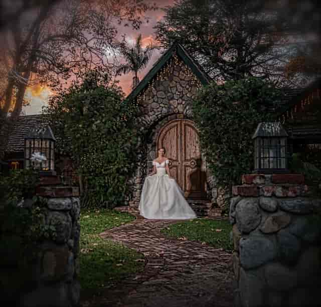 Outdoor fireplace at Enchanted Manor, rustic charm for romantic weddings and events.