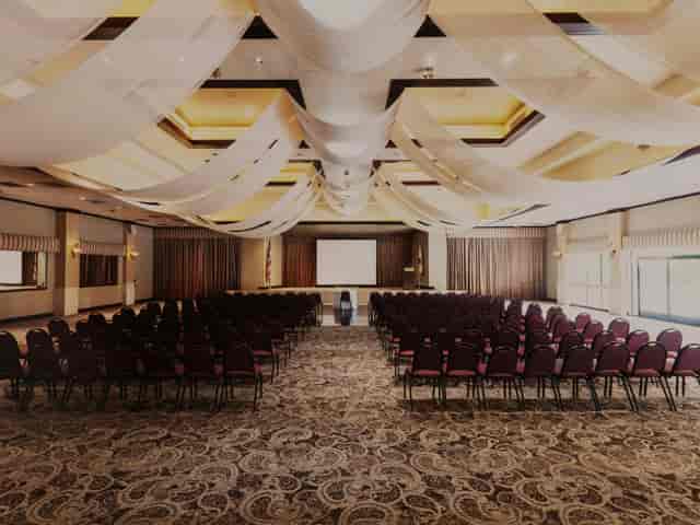 Indoor ballroom with elegant drapery, perfect for conferences and seminars.