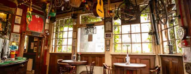 Cozy Front Bar at Faltering Fullback with rustic decor, ideal for informal meetings and gatherings.