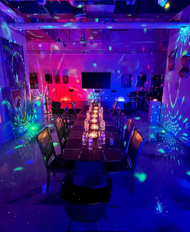 Vibrant Brunswick Art Gallery event space with elegant table setup for networking and celebrations.