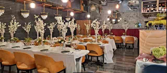 Elegant dining space with floral centerpieces for upscale corporate events.