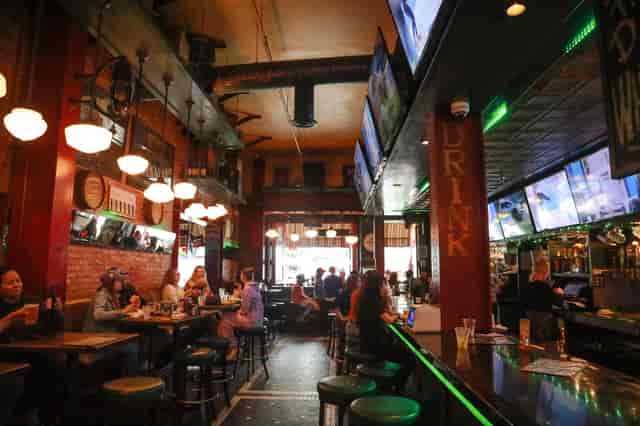 Vibrant bar at Jameson's Irish Pub, perfect for networking events and casual meetups.