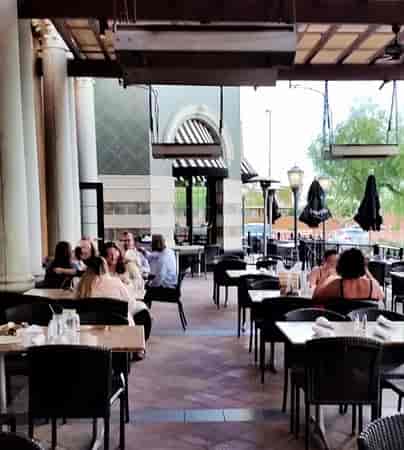 Outdoor dining area at The Cheesecake Factory, perfect for casual meetings and networking.