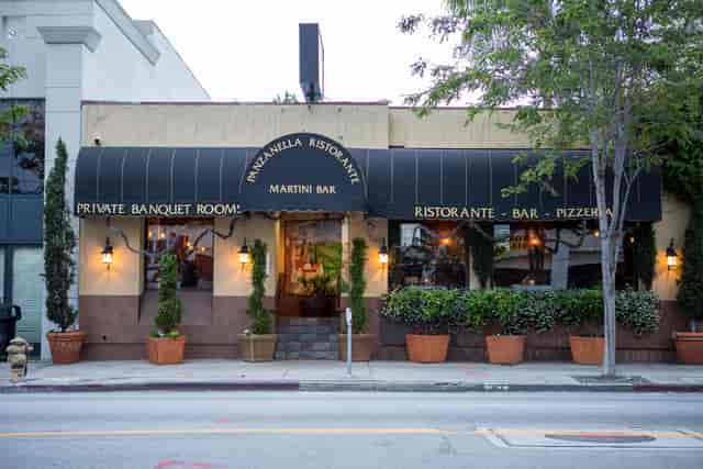 Charming restaurant patio with inviting awning, perfect for private events and banquets.