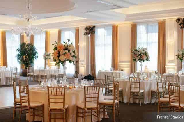 Elegant wedding venue at The Pacific Club with round tables and floral centerpieces.