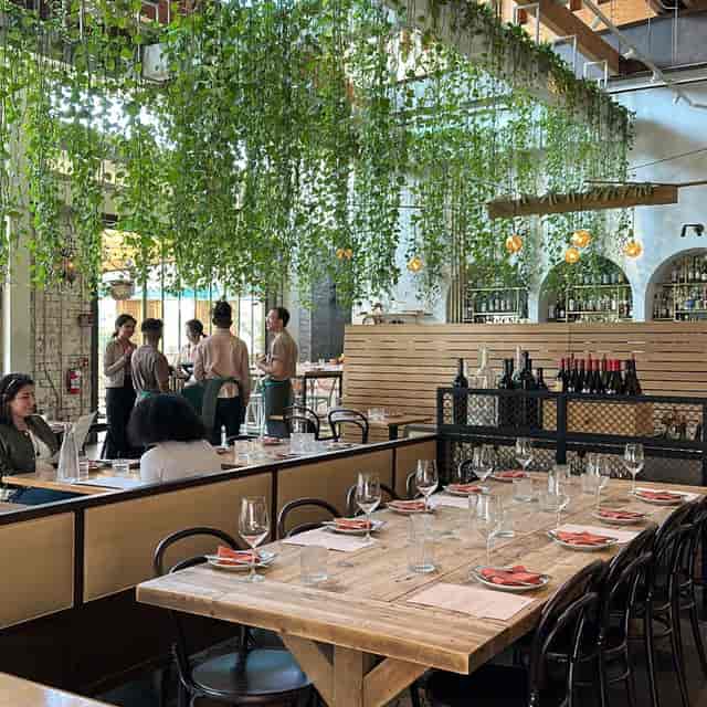 Main Dining Room in Bavel, vibrant setting for corporate events and intimate gatherings.