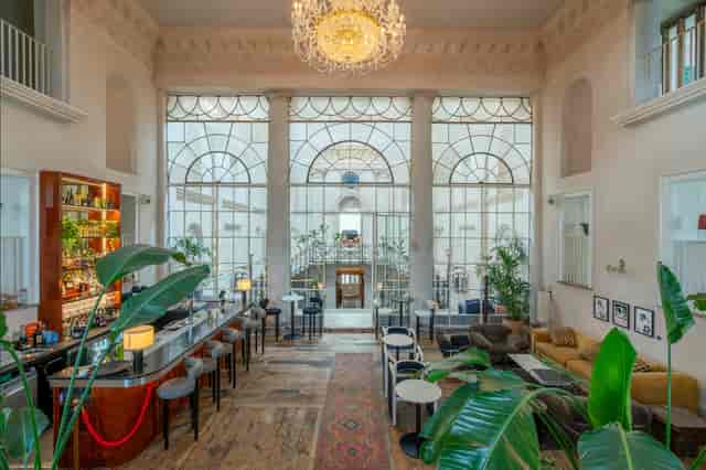 Stylish venue with large windows for meetings and events at Knotel Workclub.