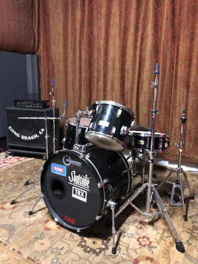 Control Room at Grooveworks Studios with a drum set for live music events.