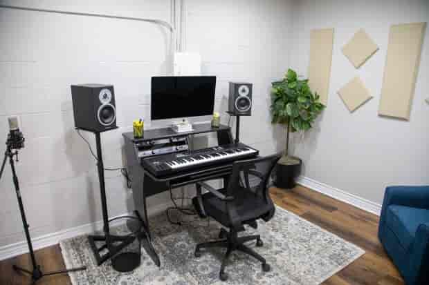 Large Rehearsal Room with audio setup, ideal for music production and workshops.