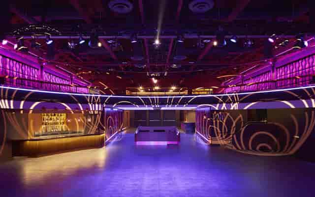 Modern event space in The Vermont Hollywood with vibrant purple lighting for corporate events.