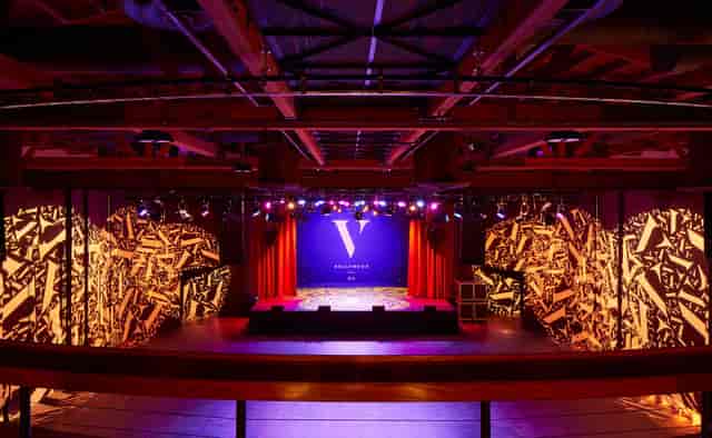 Theater in The Vermont Hollywood with vibrant lighting for conferences and performances.
