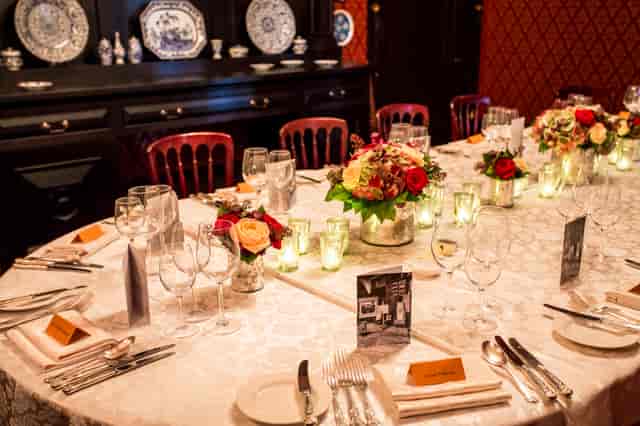 Elegant dining room setup at Leighton House for formal events and gatherings.