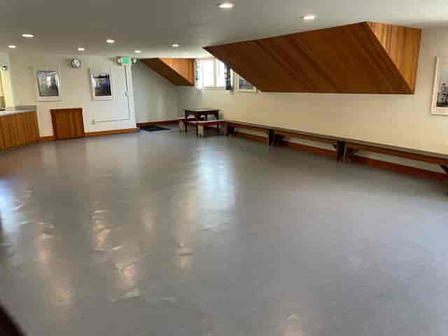 Versatile Finnish Hall auditorium with natural light, ideal for workshops and meetings.