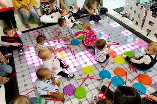 Vibrant children's play area with colorful mats for family-friendly events and birthday parties.