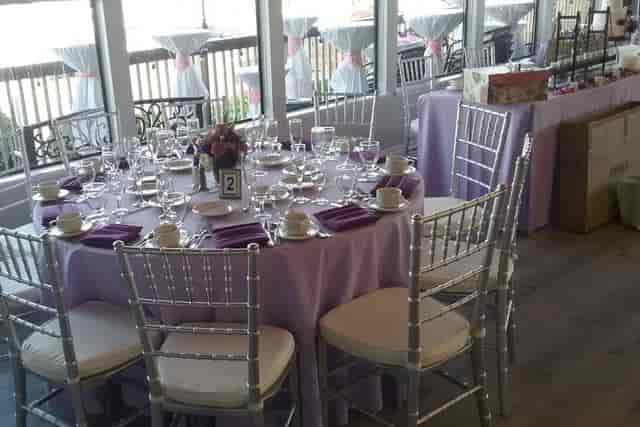 Elegant dining table with lavender decor for weddings at Dominic's Oyster Point.