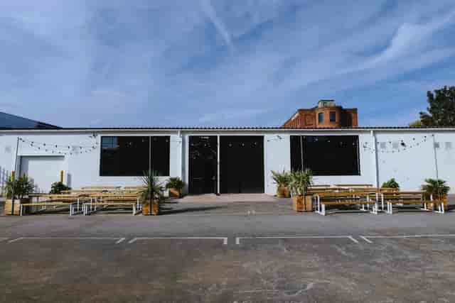 Modern event space with large windows, perfect for corporate meetings and social gatherings.