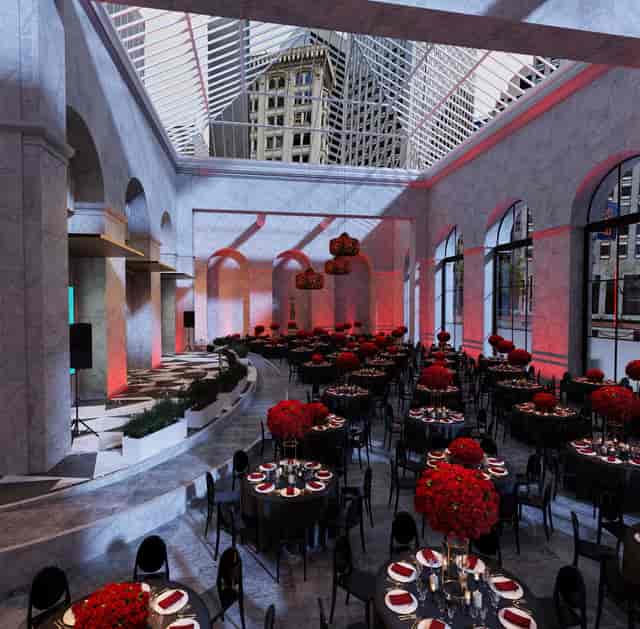 Elegant event space at Conservatory Business Park with red floral centerpieces.