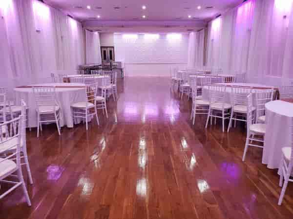 Ridgewood Hall event space with elegant chairs, ideal for weddings and corporate events.