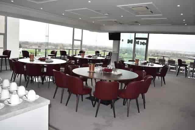 Royal Box at Sandown Park Racecourse, elegant tables set for corporate events and workshops.