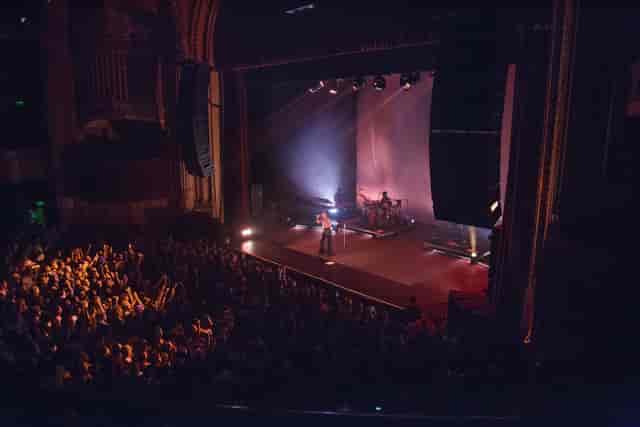 Vibrant live performance in The Warfield event space with engaging crowd and stunning acoustics.