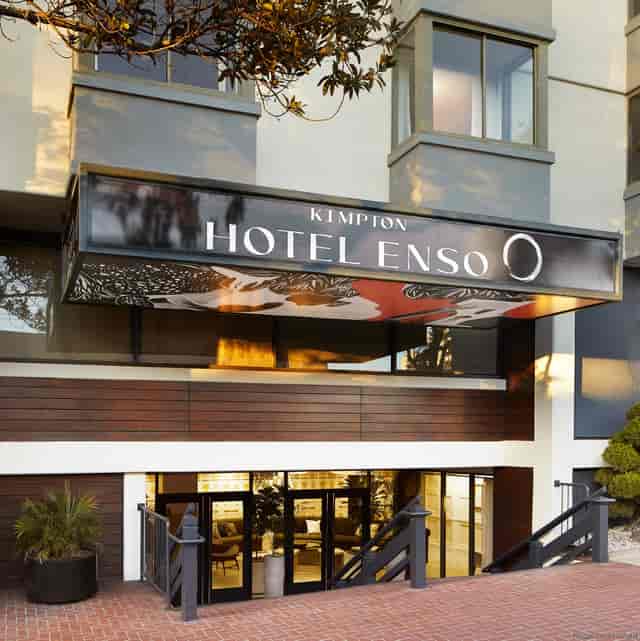 "Modern entrance of Kimpton Hotel Enso, ideal for conferences and social events."