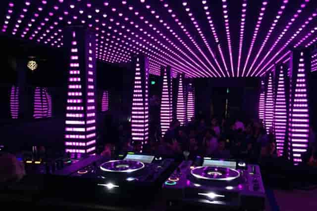 Vibrant Temple Nightclub Main Room with purple lighting, ideal for nightlife events and parties.