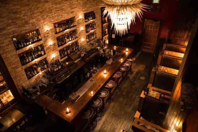 Stylish bar with warm lighting, perfect for cocktail receptions and networking events.