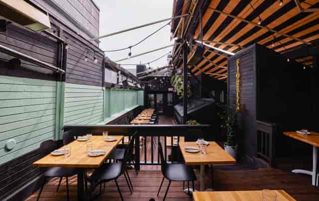 Stylish outdoor dining table in Fiorella for gatherings and networking events.