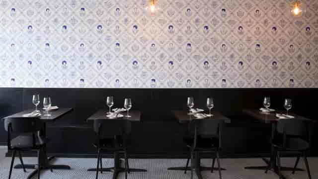 Large table in Fiorella, modern dining space for intimate gatherings and events.