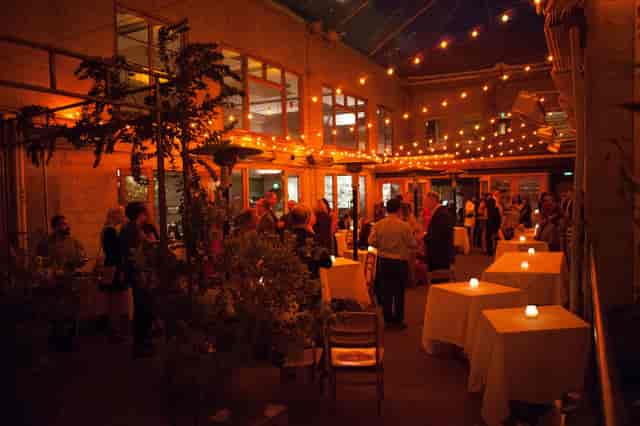 Amate Terrace event space with warm lighting, ideal for networking and social gatherings.