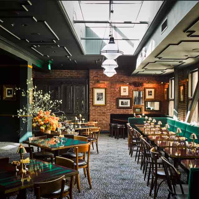 Stylish Wayfare Tavern event space with warm lighting, ideal for networking and gatherings.