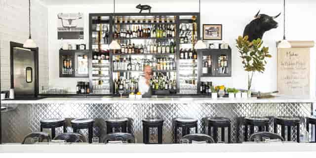Stylish bar area at Full Buyout in Marlowe, perfect for networking events and gatherings.