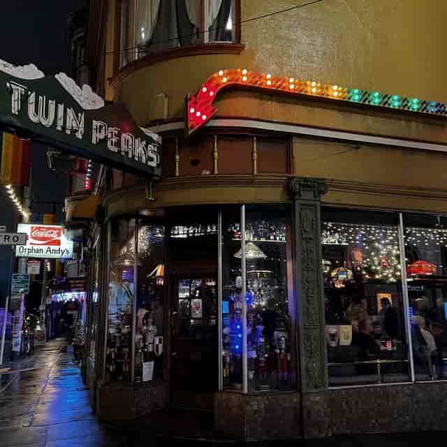 Upstairs Mezzanine at The Royale: vibrant venue with neon signs for lively events and parties.