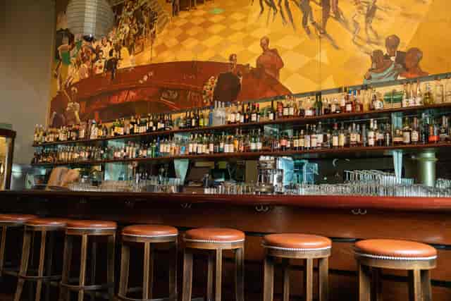 Stylish bar in BIX San Francisco with vibrant mural, perfect for cocktail receptions.