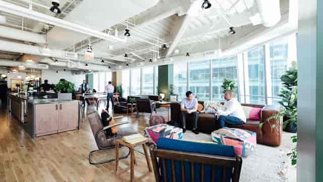 Modern private office space with natural light for networking and collaboration events.